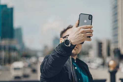 mobile phone person takes photo phone